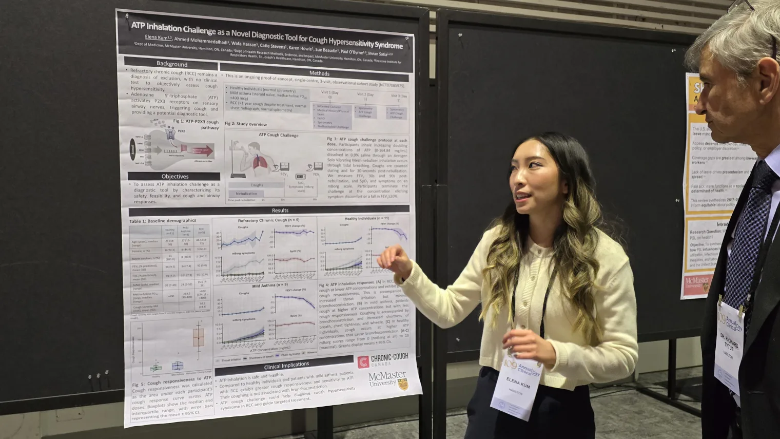 A medical learner presents her research poster to a physician at the Clinical Day poster session